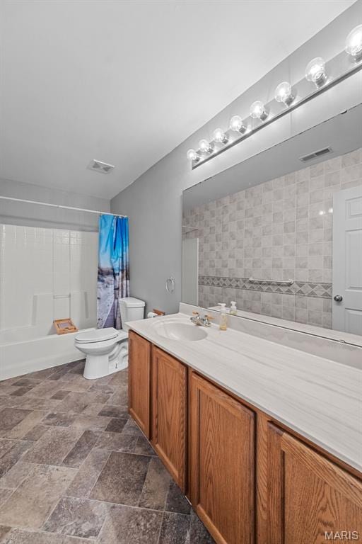 11264 Village Dr, Foristell, MO 63348 - bathroom with vanity, shower / bath combo with shower curtain, and stone finish floors