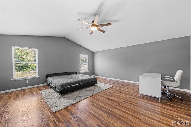 11264 Village Dr, Foristell, MO 63348 - bedroom with multiple windows, lofted ceiling, wood finished floors, and a ceiling fan