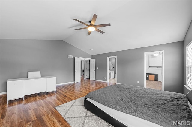 11264 Village Dr, Foristell, MO 63348 - bedroom with lofted ceiling, wood finished floors, ceiling fan, and connected bathroom