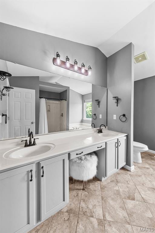 11264 Village Dr, Foristell, MO 63348 - bathroom with double vanity, lofted ceiling, tile patterned flooring, and a shower with curtain
