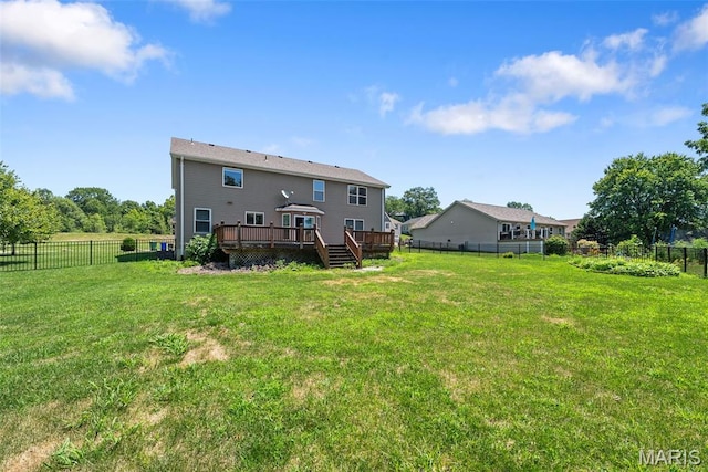 11264 Village Dr, Foristell, MO 63348 - back of house featuring a deck and a fenced backyard