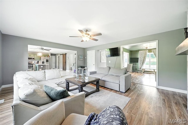 11264 Village Dr, Foristell, MO 63348 - living area with a ceiling fan and wood finished floors