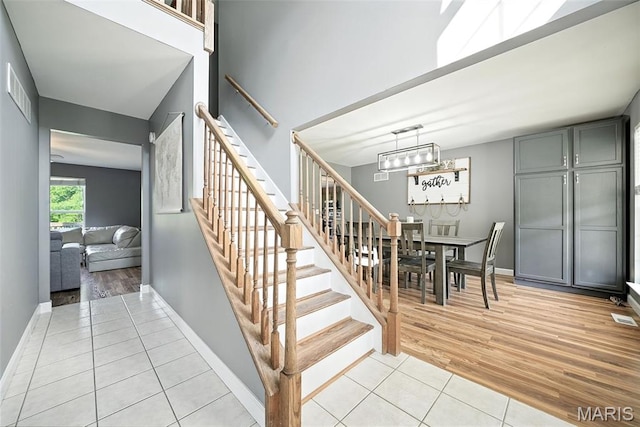 11264 Village Dr, Foristell, MO 63348 - staircase with wood finished floors and baseboards