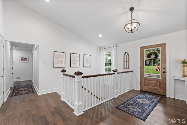 1715 Pine Hill Dr, Des Peres, MO 63131 - foyer featuring wood finished floors, a chandelier, high vaulted ceiling, and recessed lighting