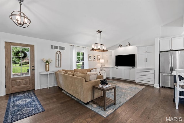1715 Pine Hill Dr, Des Peres, MO 63131 - living room featuring a chandelier, dark wood-type flooring, and vaulted ceiling