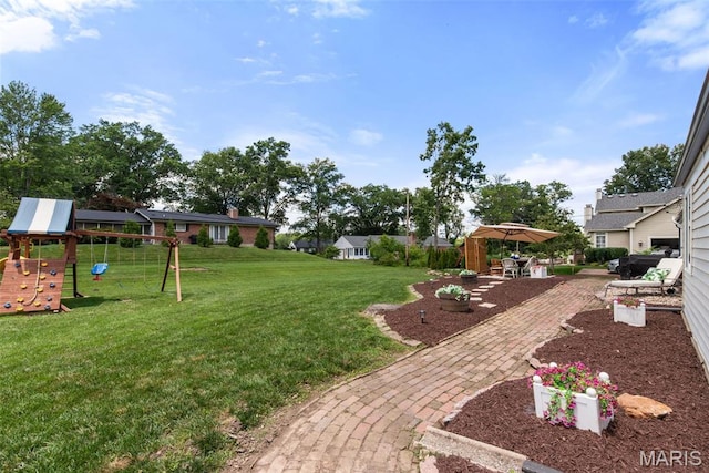 1715 Pine Hill Dr, Des Peres, MO 63131 - view of grassy yard featuring a playground and a patio