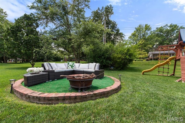 1715 Pine Hill Dr, Des Peres, MO 63131 - view of green lawn with an outdoor living space with a fire pit, a playground, and view of scattered trees