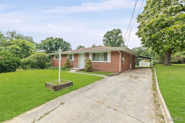 3120 Hawthorne Blvd, Alton, IL 62002 - ranch-style house with a shed, brick siding, a carport, driveway, and a front lawn