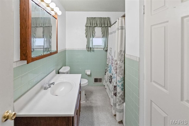 3120 Hawthorne Blvd, Alton, IL 62002 - full bath with tile walls, wainscoting, vanity, tile patterned flooring, and curtained shower