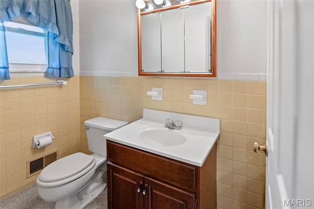 3120 Hawthorne Blvd, Alton, IL 62002 - half bathroom with tile walls, vanity, and a wainscoted wall