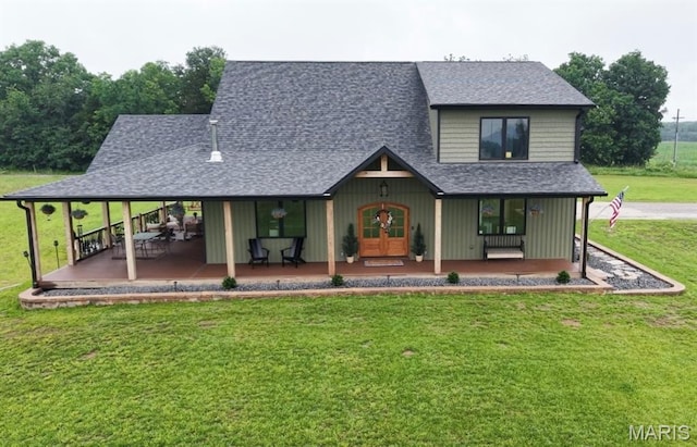 14005 Osage Dr, New London, MO 63459 - country-style home with a front yard, roof with shingles, covered porch, and french doors