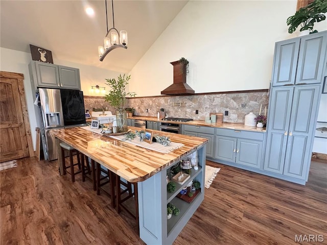 14005 Osage Dr, New London, MO 63459 - kitchen featuring stainless steel refrigerator with ice dispenser, wood counters, dark wood finished floors, gray cabinets, and lofted ceiling