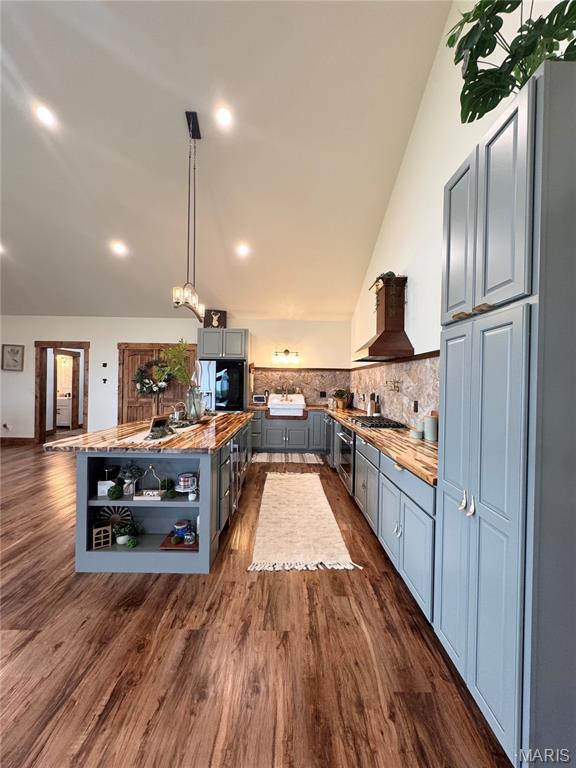 14005 Osage Dr, New London, MO 63459 - kitchen featuring premium range hood, butcher block counters, open shelves, gray cabinets, and lofted ceiling