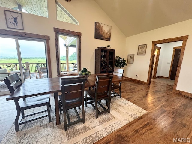 14005 Osage Dr, New London, MO 63459 - dining area featuring high vaulted ceiling, healthy amount of natural light, and wood finished floors