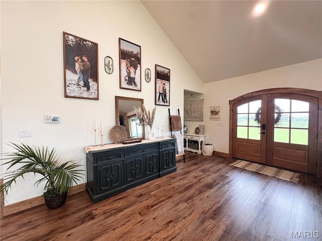 14005 Osage Dr, New London, MO 63459 - foyer featuring french doors, dark wood-style floors, high vaulted ceiling, and arched walkways