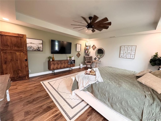 14005 Osage Dr, New London, MO 63459 - bedroom with a raised ceiling and wood finished floors