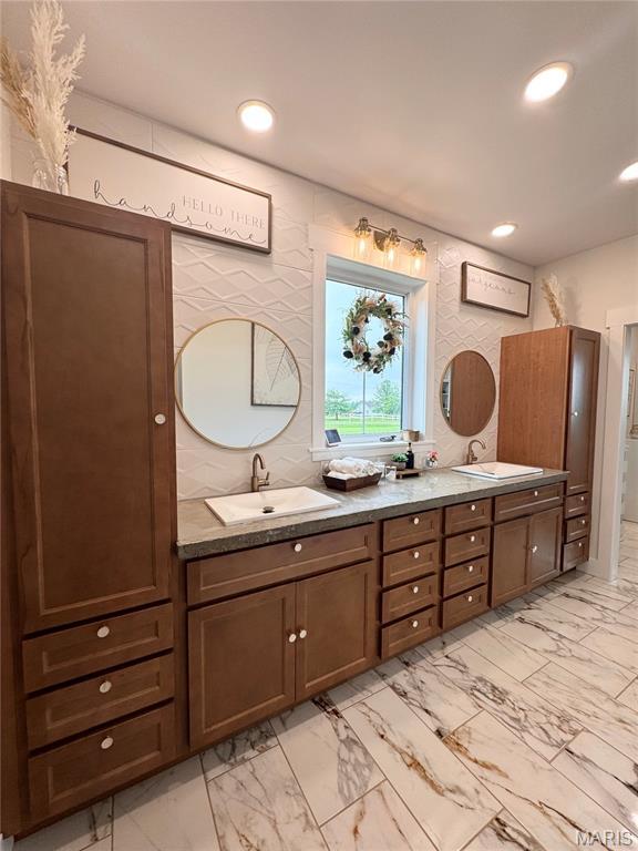 14005 Osage Dr, New London, MO 63459 - full bathroom with double vanity, marble look tiles, and recessed lighting