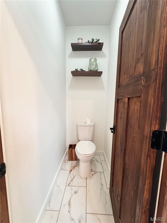 14005 Osage Dr, New London, MO 63459 - bathroom featuring marble finish floors and toilet