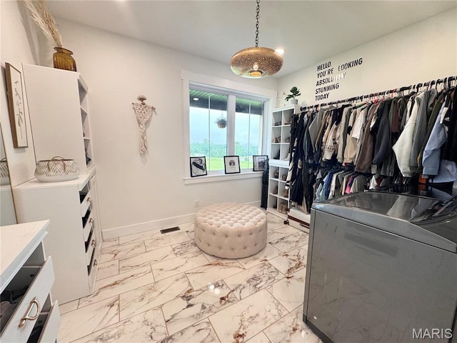 14005 Osage Dr, New London, MO 63459 - spacious closet with light marble finish flooring and washer / dryer