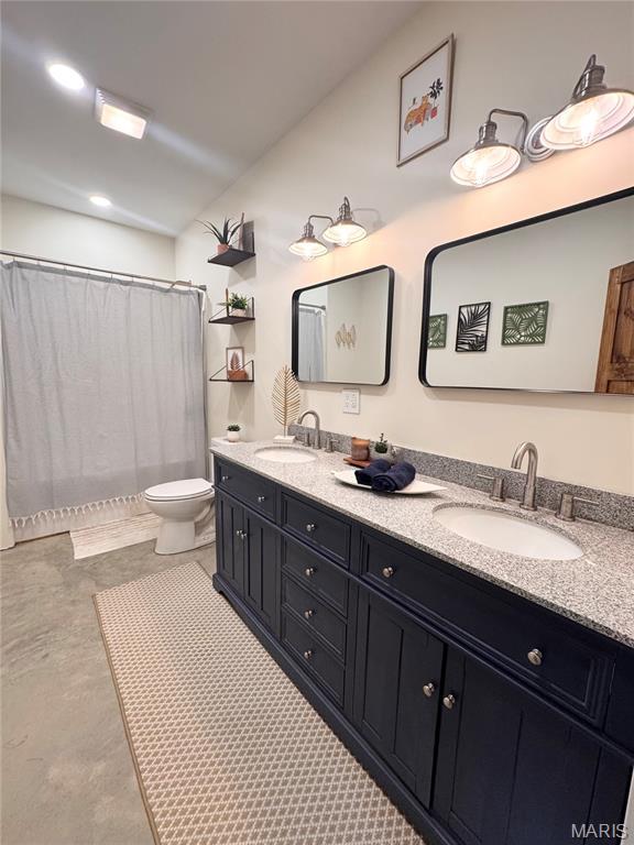 14005 Osage Dr, New London, MO 63459 - full bathroom with double vanity and a shower with shower curtain
