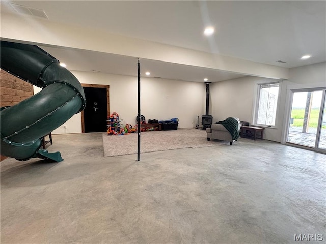 14005 Osage Dr, New London, MO 63459 - below grade area featuring a wood stove and recessed lighting