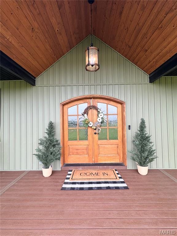 14005 Osage Dr, New London, MO 63459 - view of exterior entry with board and batten siding and french doors