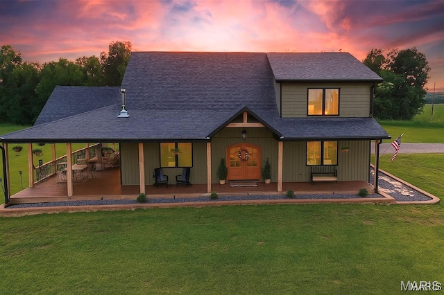 14005 Osage Dr, New London, MO 63459 - view of front of home featuring a porch, a lawn, and roof with shingles