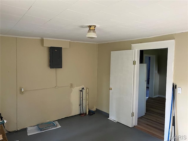 1032 W Pearl St, Staunton, IL 62088 - basement featuring electric panel, freestanding refrigerator, and crown molding