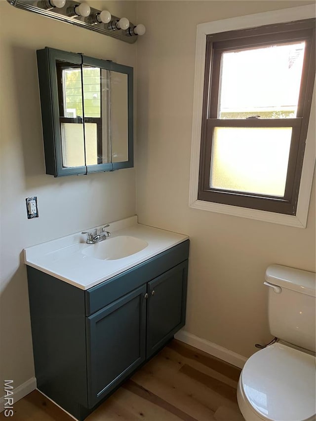 1032 W Pearl St, Staunton, IL 62088 - half bathroom featuring vanity and wood finished floors