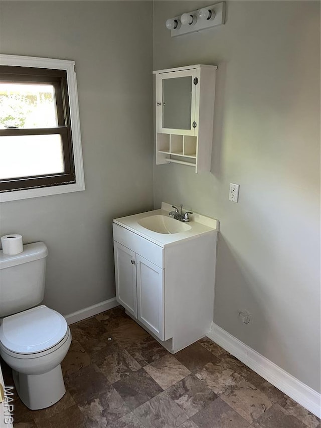 1032 W Pearl St, Staunton, IL 62088 - half bath featuring vanity and stone finish flooring