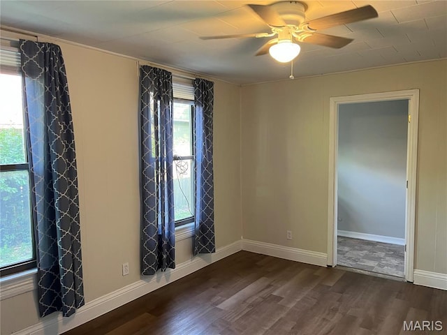 1032 W Pearl St, Staunton, IL 62088 - unfurnished room with dark wood finished floors and a ceiling fan