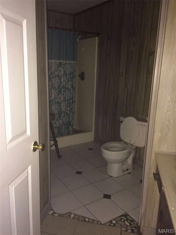 2794 US Highway 160, Doniphan, MO 63935 - bathroom with a shower stall, vanity, and tile patterned floors
