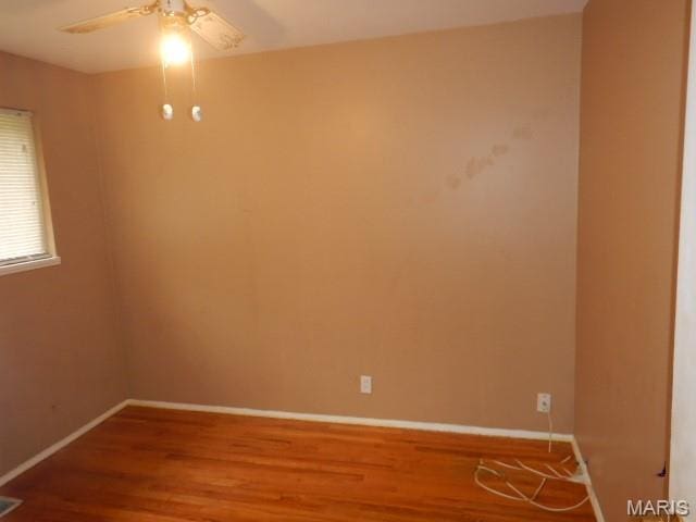 10246 Dacey Dr, Saint Louis, MO 63136 - spare room with wood finished floors and a ceiling fan
