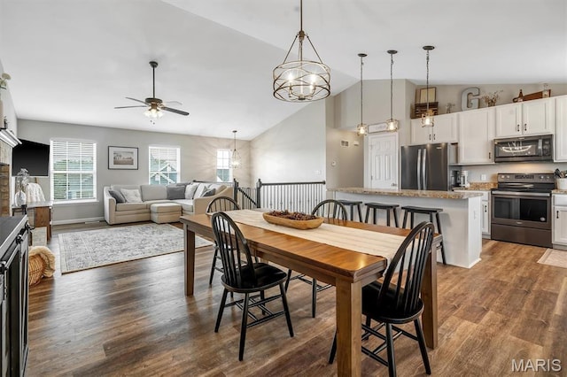 1424 Cortez Dr, Hillsboro, MO 63050 - dining space with ceiling fan, dark wood-style floors, and high vaulted ceiling