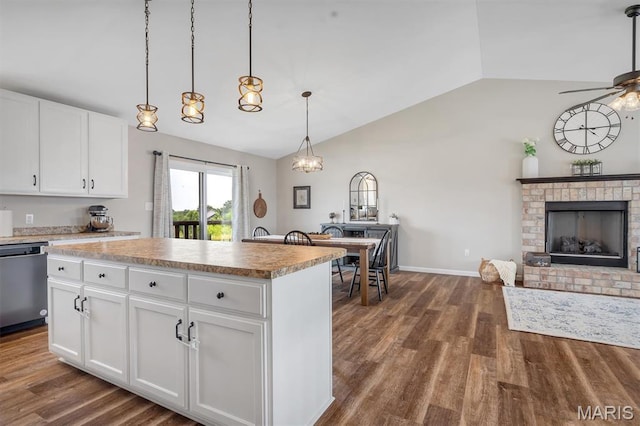 1424 Cortez Dr, Hillsboro, MO 63050 - kitchen featuring stainless steel dishwasher, lofted ceiling, dark wood-style flooring, ceiling fan, and a kitchen island