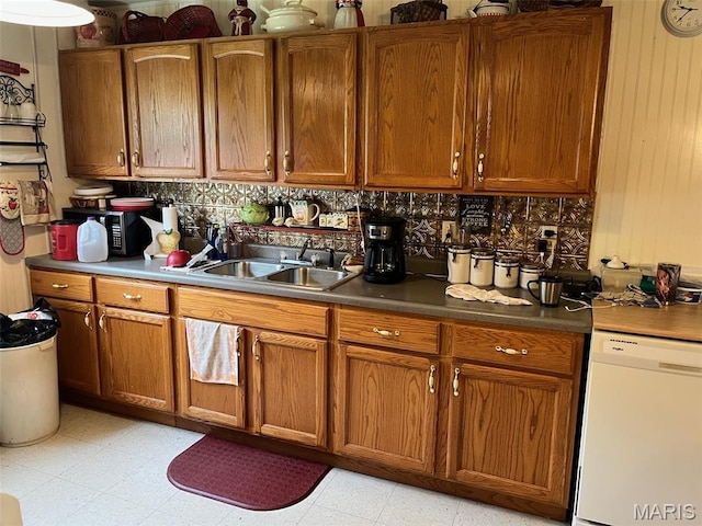 13688 State Highway U, Mineral Point, MO 63660 - kitchen featuring white dishwasher, brown cabinetry, and decorative backsplash