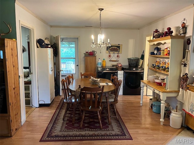 13688 State Highway U, Mineral Point, MO 63660 - dining room featuring washer / dryer, light wood-style flooring, a chandelier, and crown molding