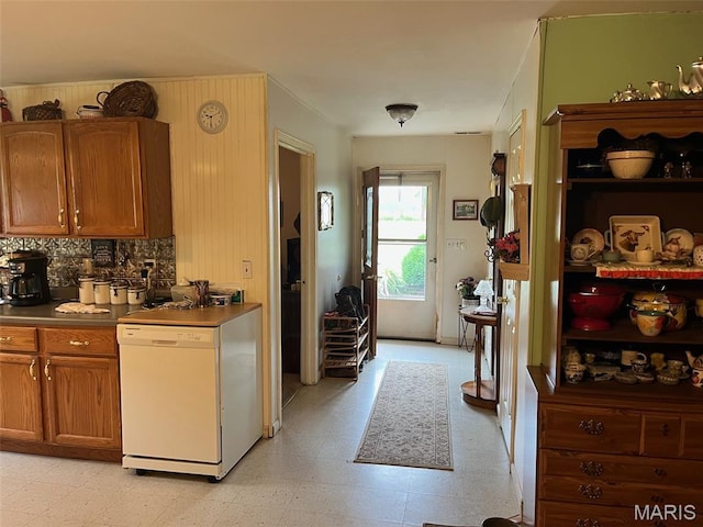 13688 State Highway U, Mineral Point, MO 63660 - kitchen with dishwasher, light flooring, brown cabinets, and decorative backsplash