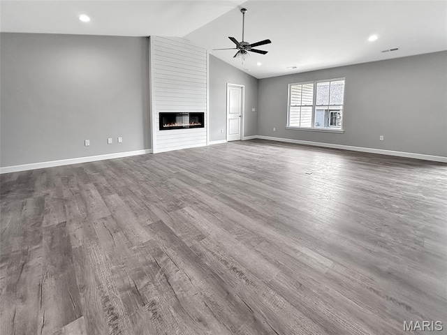 9 Sonata Ln, Troy, IL 62294 - unfurnished living room with ceiling fan, vaulted ceiling, wood finished floors, a large fireplace, and recessed lighting