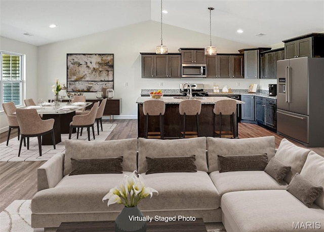 9 Sonata Ln, Troy, IL 62294 - living room with lofted ceiling, light wood-style flooring, and recessed lighting