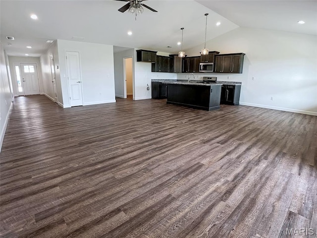 9 Sonata Ln, Troy, IL 62294 - kitchen with stainless steel microwave, open floor plan, a kitchen island with sink, a ceiling fan, and vaulted ceiling