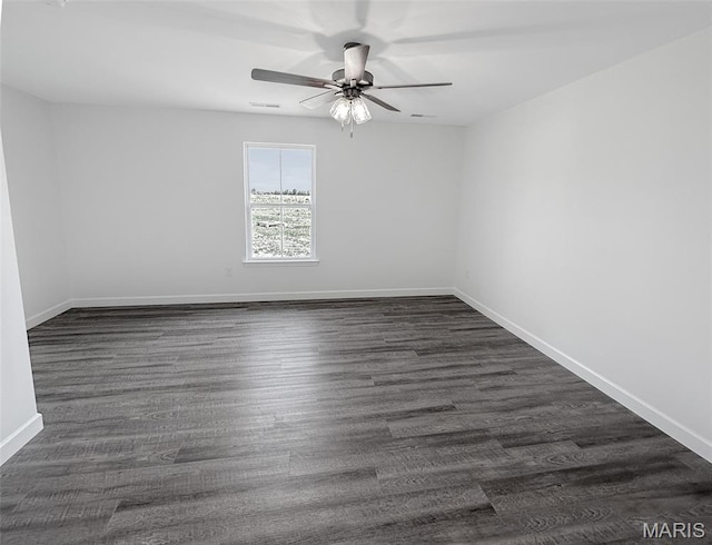 9 Sonata Ln, Troy, IL 62294 - spare room featuring a ceiling fan and dark wood-style floors