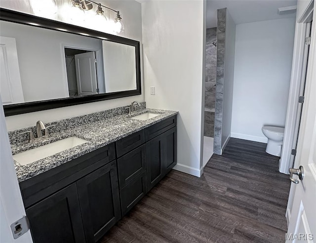 9 Sonata Ln, Troy, IL 62294 - bathroom featuring wood finished floors, double vanity, and a tile shower