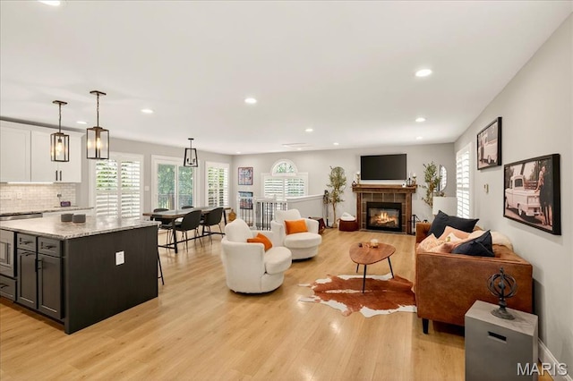 6521 Woodland Dr, Cedar Hill, MO 63016 - living area featuring light wood-style floors, recessed lighting, and a fireplace