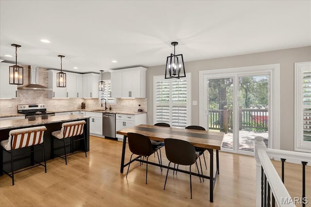 6521 Woodland Dr, Cedar Hill, MO 63016 - dining area featuring light wood-style floors, recessed lighting, and a chandelier