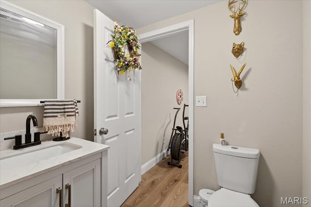 6521 Woodland Dr, Cedar Hill, MO 63016 - half bathroom with wood finished floors and vanity