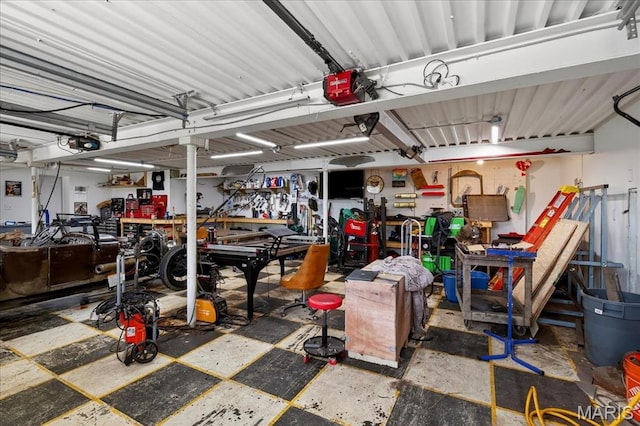 6521 Woodland Dr, Cedar Hill, MO 63016 - garage featuring a workshop area and a garage door opener