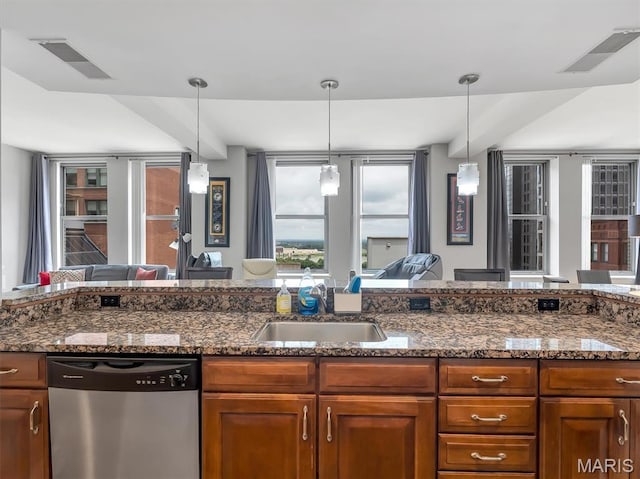 314 N Broadway Unit 1107, Saint Louis, MO 63102 - kitchen with stainless steel dishwasher, brown cabinets, and open floor plan