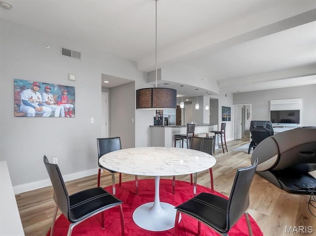 314 N Broadway Unit 1107, Saint Louis, MO 63102 - dining space featuring light wood-type flooring