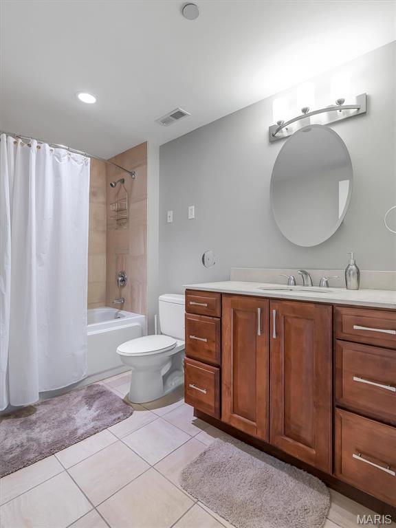 314 N Broadway Unit 1107, Saint Louis, MO 63102 - bathroom with vanity, shower / tub combo, and tile patterned flooring